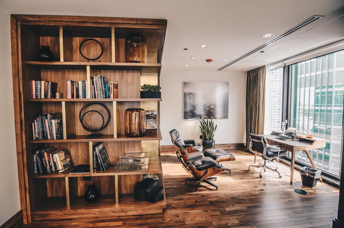 A quiet, book-lined private office — continuity and discretion