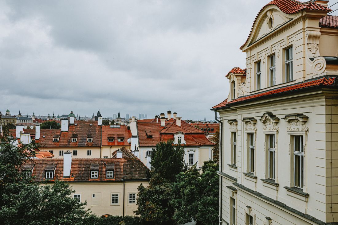 A historic European old town with red-tiled rooftops